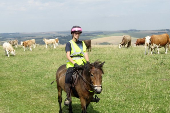 Julia smiling and cows